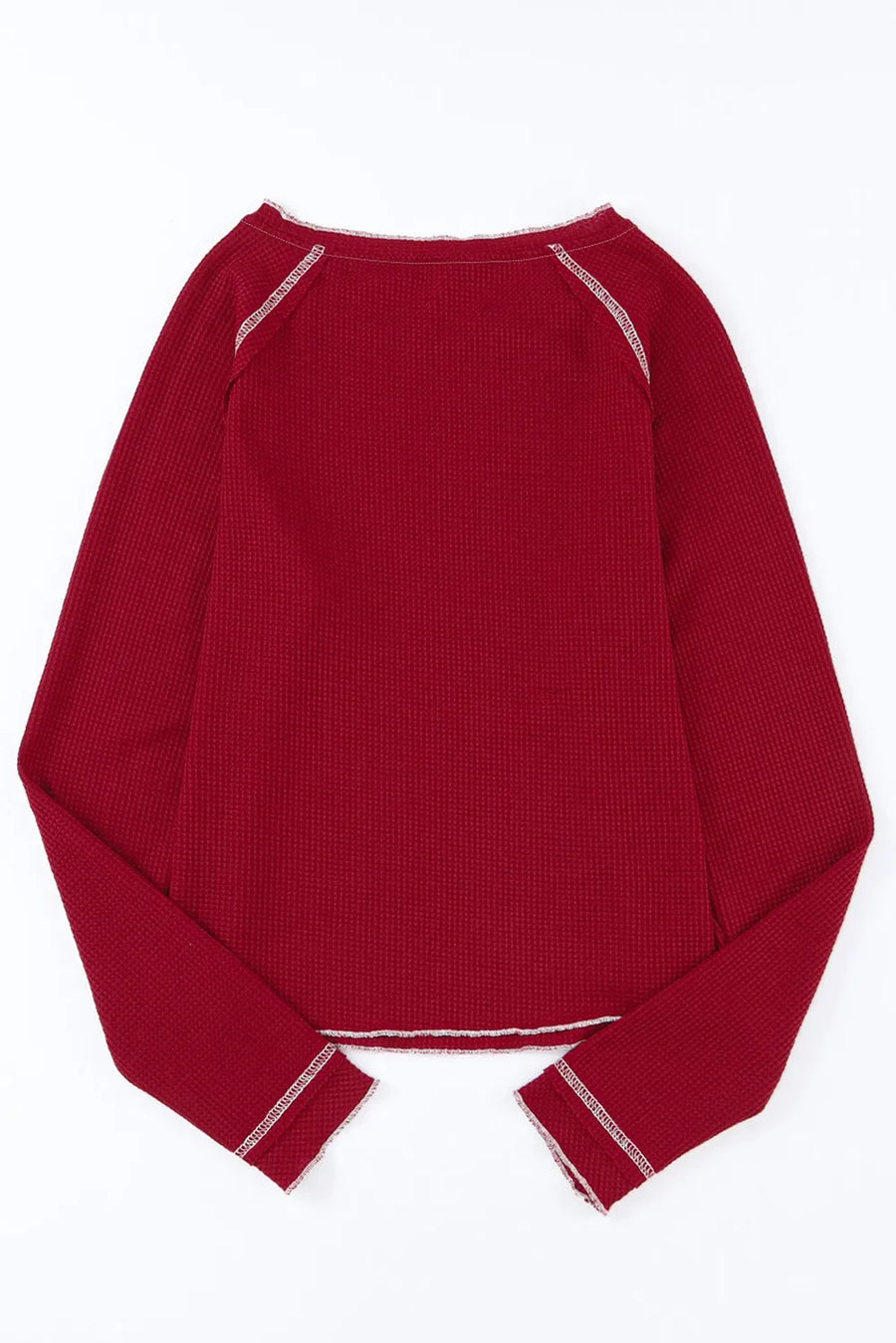 Burgundy waffle knit crewneck top with contrast stitching on neckline and cuffs.