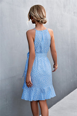 Pastel blue dotted halter neck mini dress with ruffle hem and tie waist.