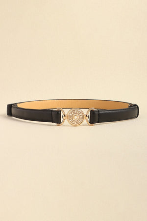 Black leather belt with crystal-embellished gold circular buckle and side details.
