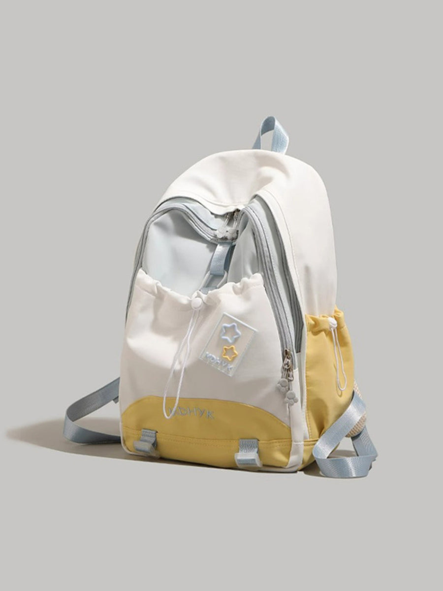 Nylon drawstring backpack in cream and yellow with multiple pockets and star details.