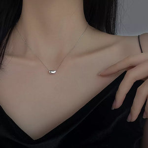 Elegant bean pendant necklace in sterling silver with a delicate box chain.