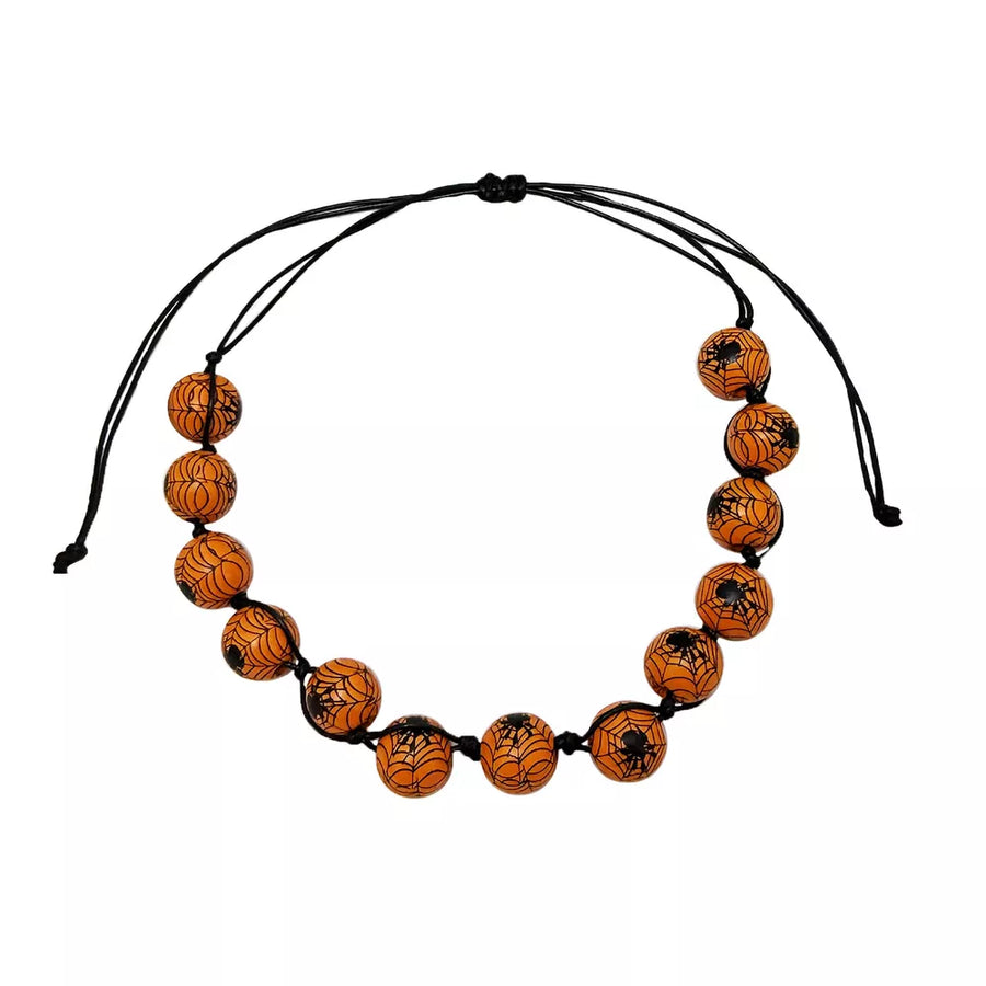 white necklace with clasp and eyeball-print