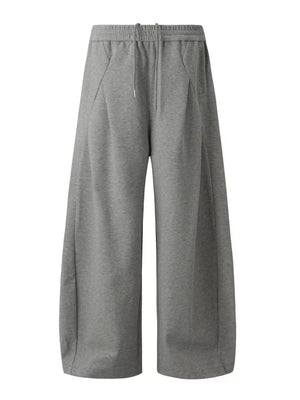 sweatpants in grey featuring drawstring waist and wide-leg fit
