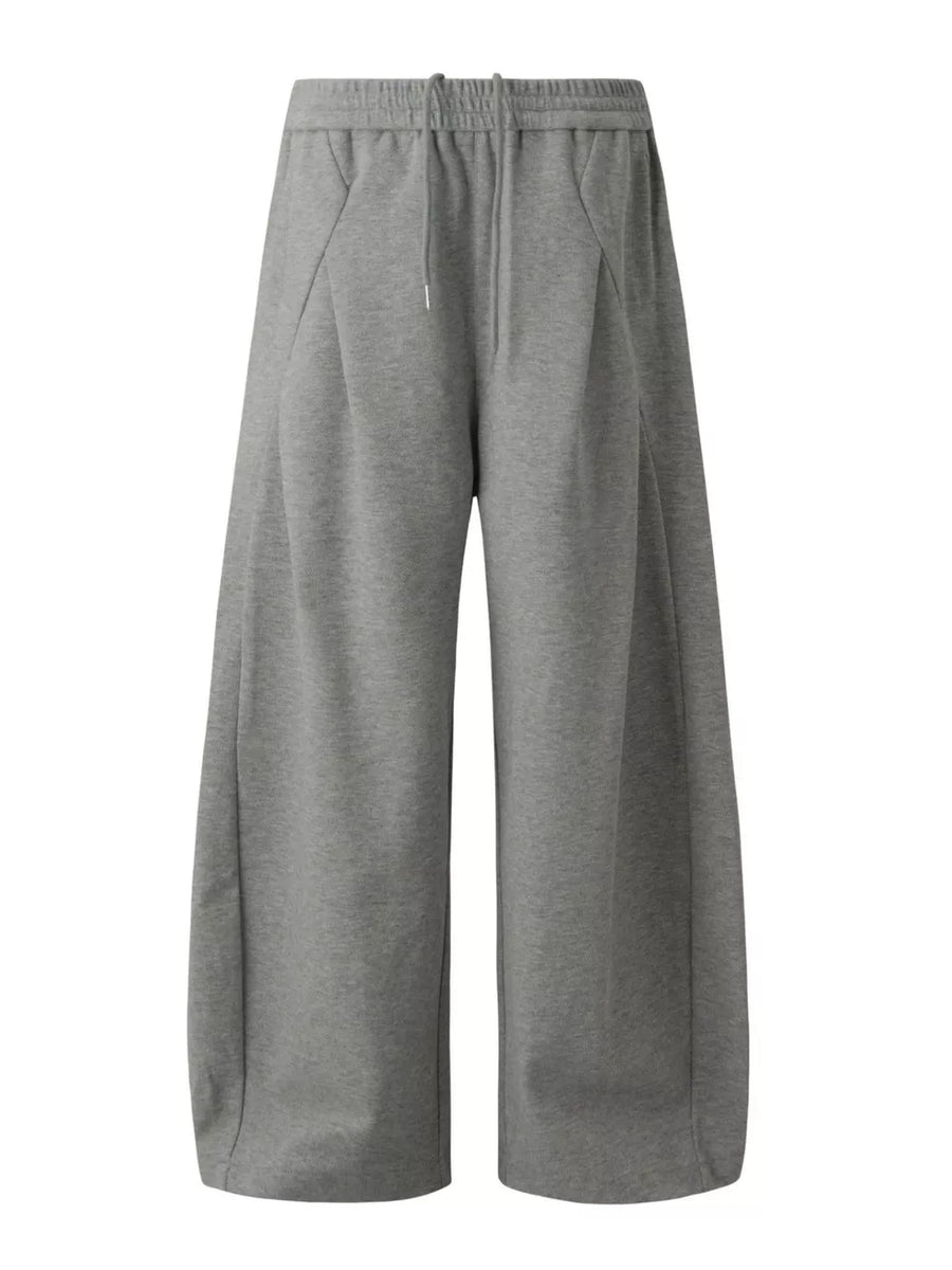 sweatpants in grey featuring drawstring waist and wide-leg fit