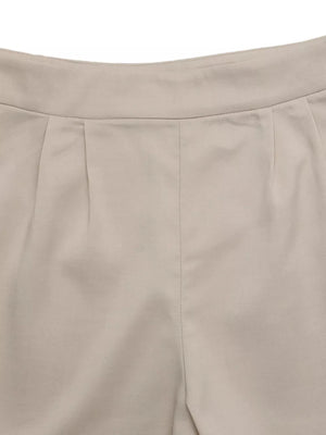 Beige polyester shorts with pleats and a high waistband.