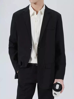 Men's black classic fit sport jacket with two buttons and notched lapels.