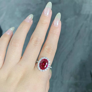 ring in ruby red featuring oval cut and fitted fit