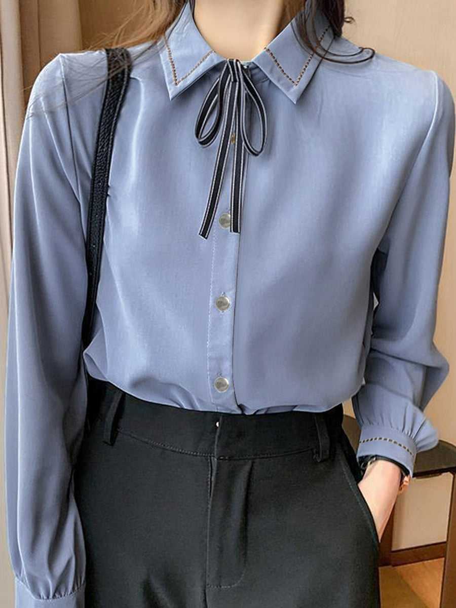 periwinkle blouse with hip-length and button-front