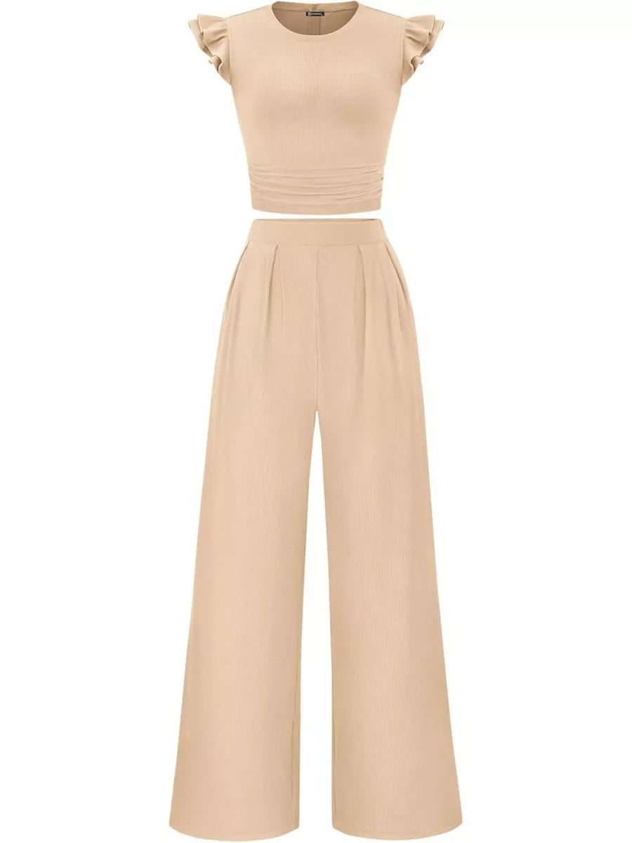 Apricot ruffled cap sleeve maternity top with ruched waist and wide leg pants.