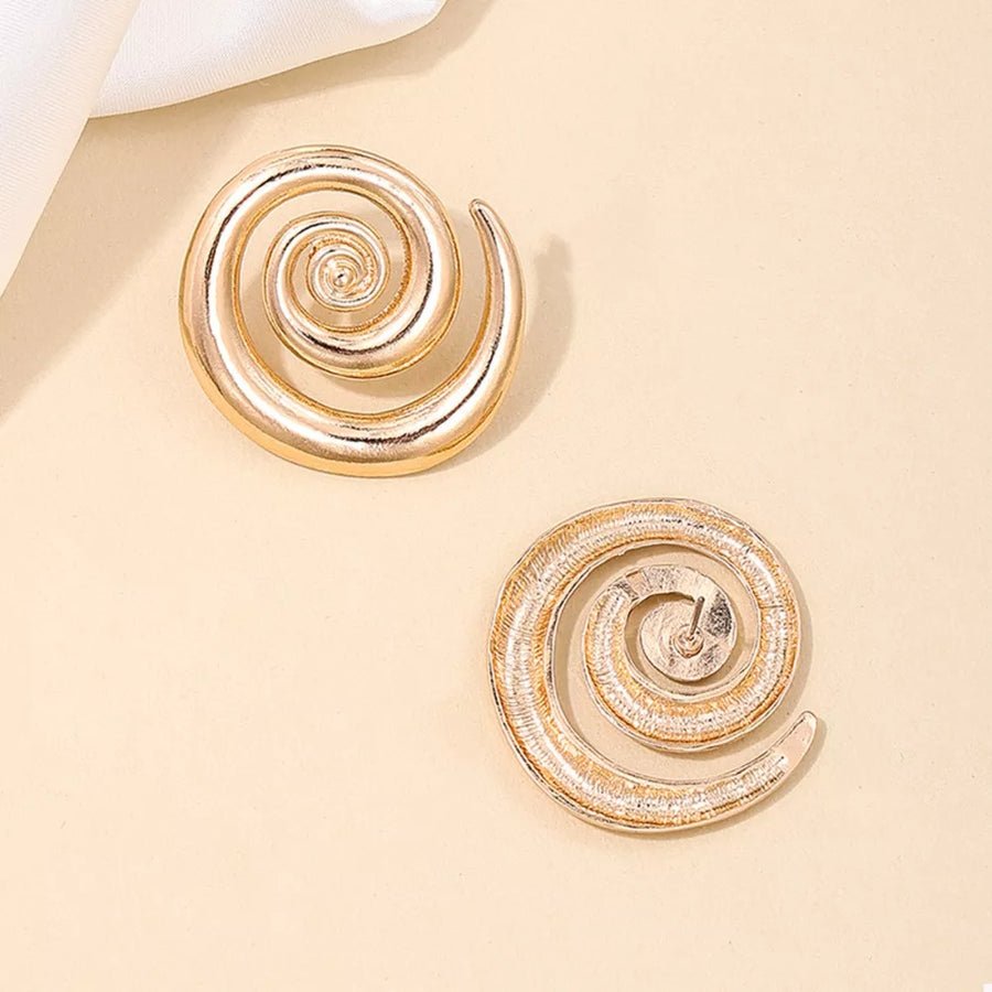 Gold earrings featuring statement and geometric