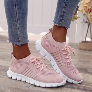 athletic shoes in blush pink featuring breathable mesh and athletic sneaker fit