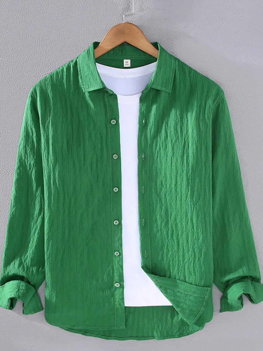 Green textured long sleeve button-up overshirt with classic collar and white t-shirt underneath.