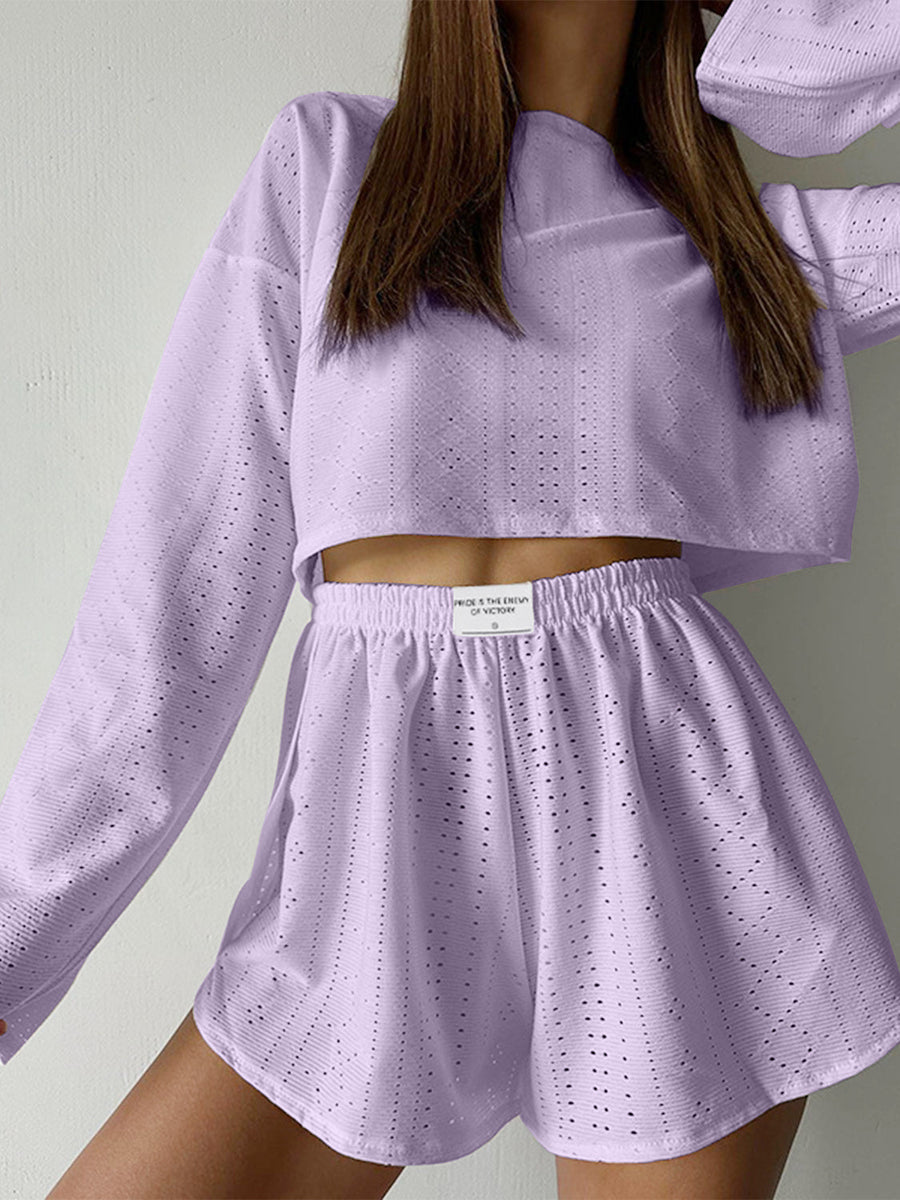 Lavender perforated crop top and shorts set with long sleeves and elastic waistband.
