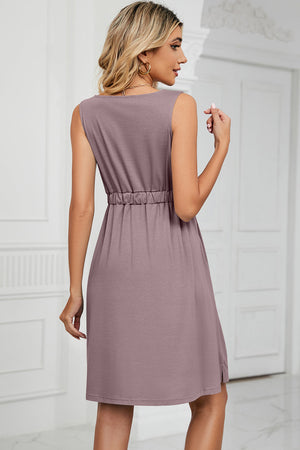 Lilac sleeveless a-line summer dress with elastic waist and button-down front detail.