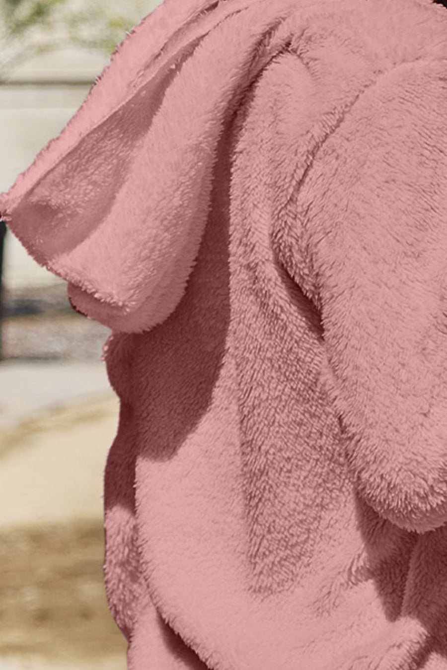 Plush hooded cardigan jacket in blush pink with a soft, fuzzy texture.