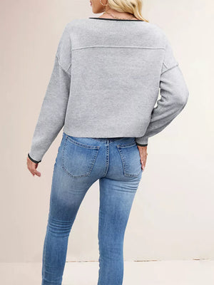 100% Acrylic Care instructions: Machine wash cold pullover sweater in Black with relaxed silhouette