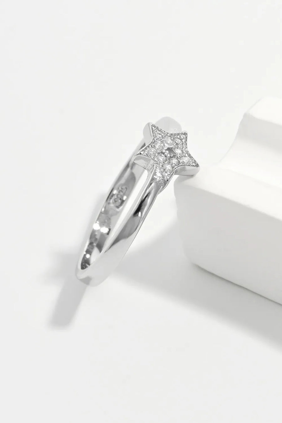 Silver ring with a diamond-encrusted star design