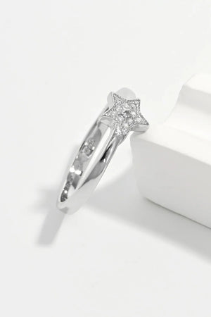 Silver ring with a diamond-encrusted star design