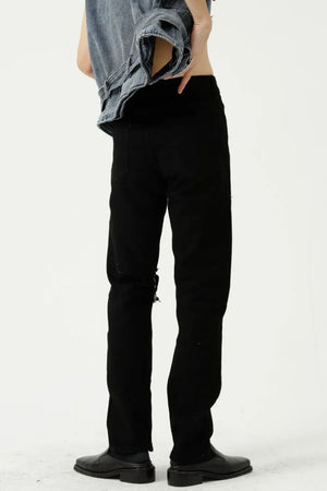 Black distressed knee modern straight leg jeans with a casual, chic style.