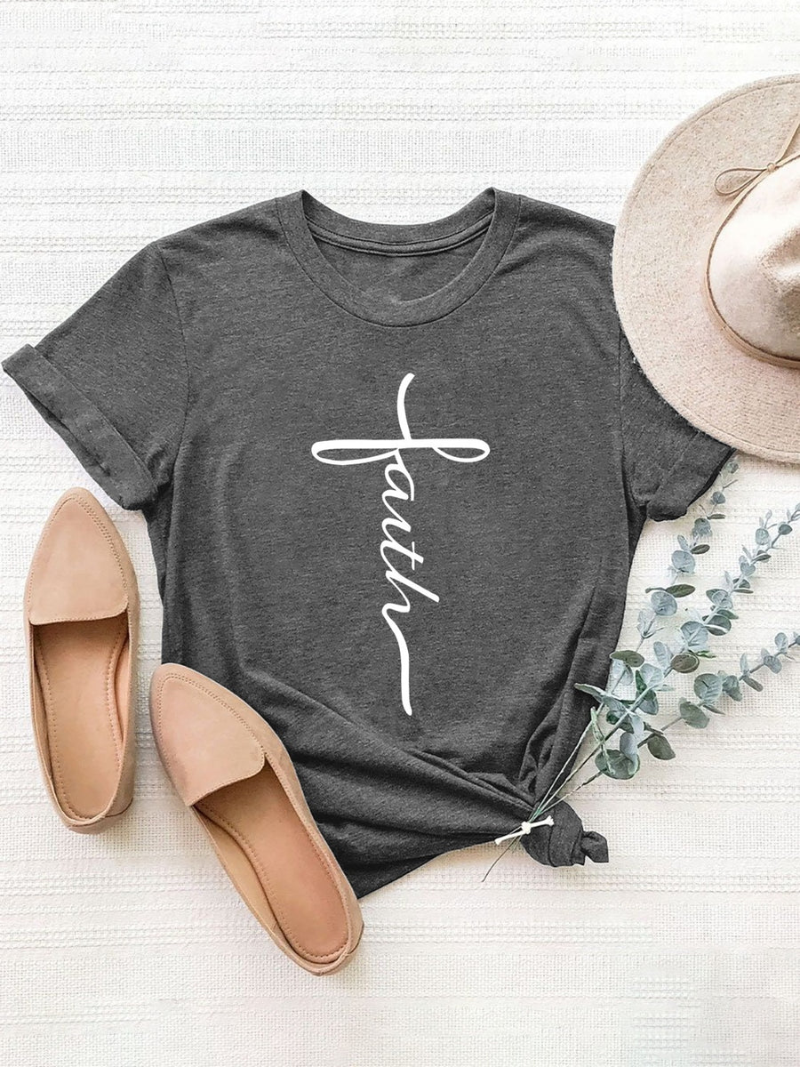 Dark gray t-shirt with white faith cross graphic, cuffed short sleeves, and knotted hem.