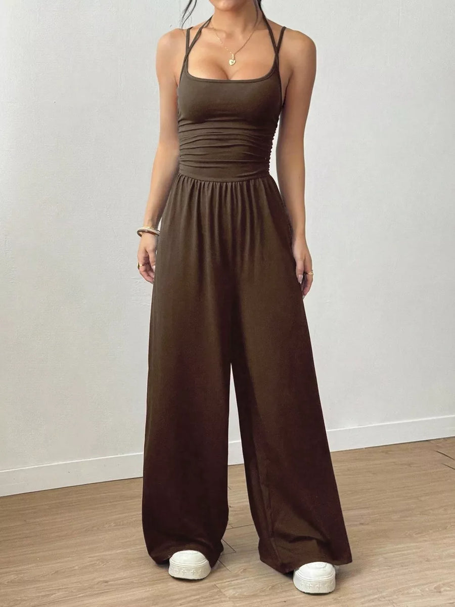 100% polyester Care instructions: Machine wash cold jumpsuit in Brown with flared silhouette