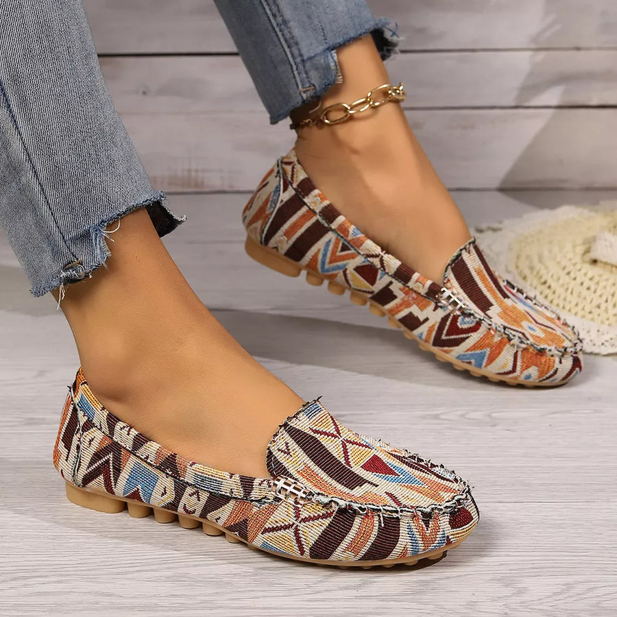 orange shoes featuring round toe and geometric