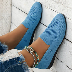Light blue breathable knit slip-on loafers with a textured pattern.