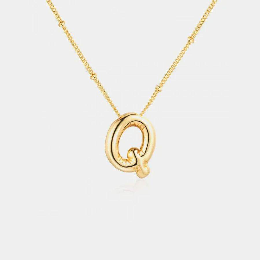 Gold initial Q charm necklace with beaded chain