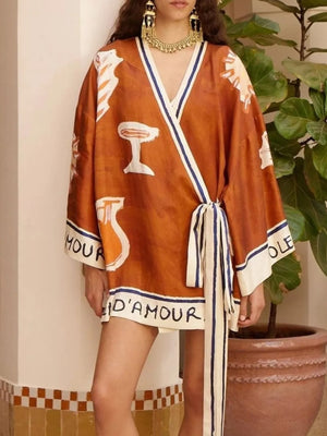 terracotta wrap dress with graphic print and v-neck