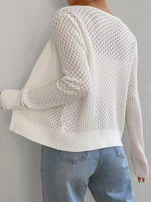 White openwork knit cardigan with a diamond pattern and ribbed cuffs and hem.