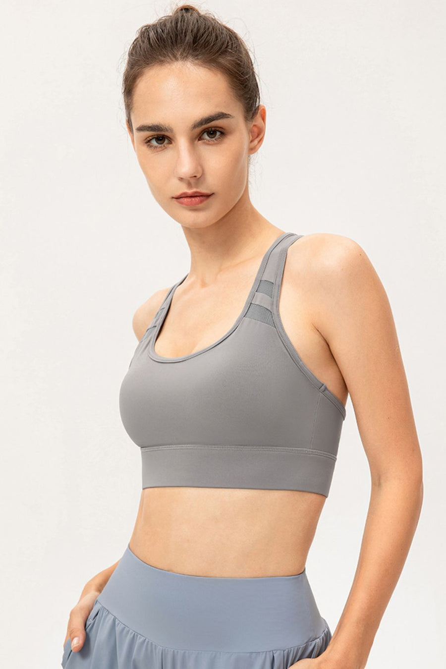 Light Gray mesh-inset performance sports bra with scoop neck and racerback straps.