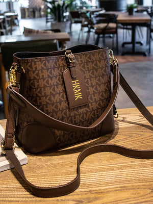 crossbody bag in Caramel with monogram and adjustable strap