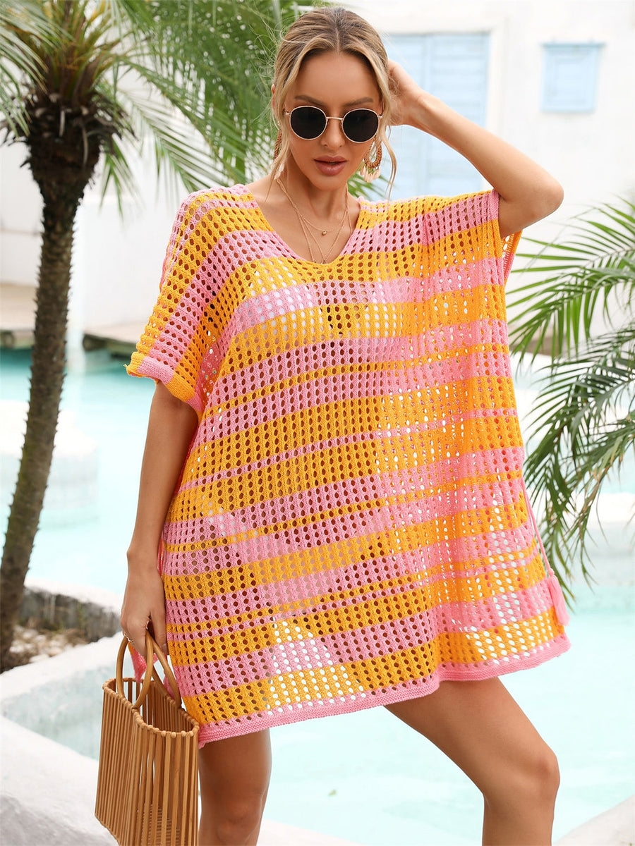 Striped crochet beach cover-up in pink and orange with V-neck and short sleeves.