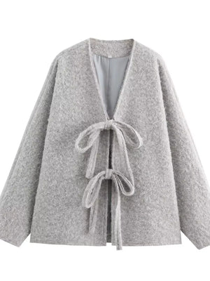 Textured knit tie-front coat in silver gray with a V-neck and long sleeves.