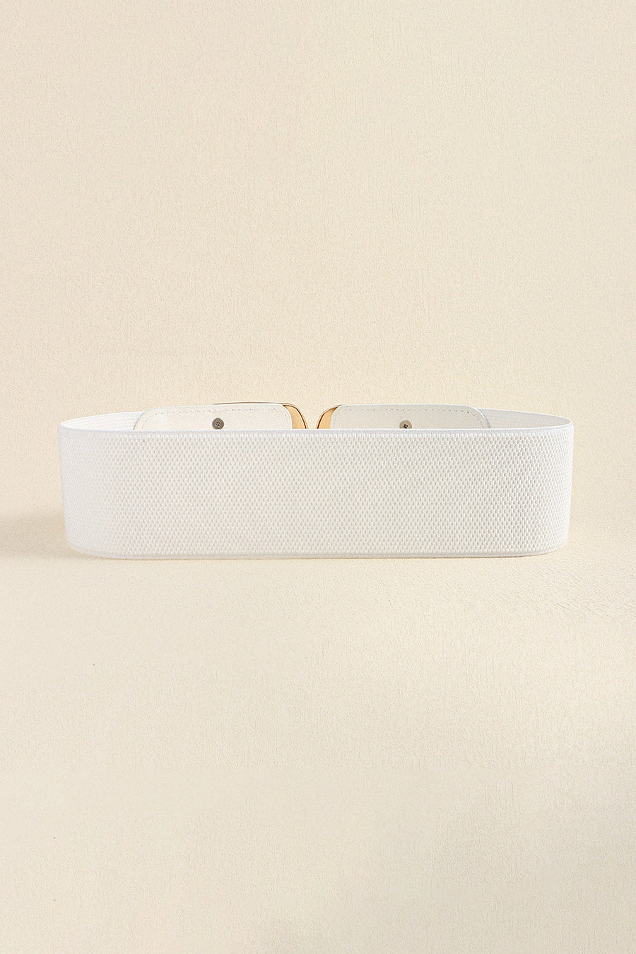 White elastic waist belt with double C buckle and gold hardware detail