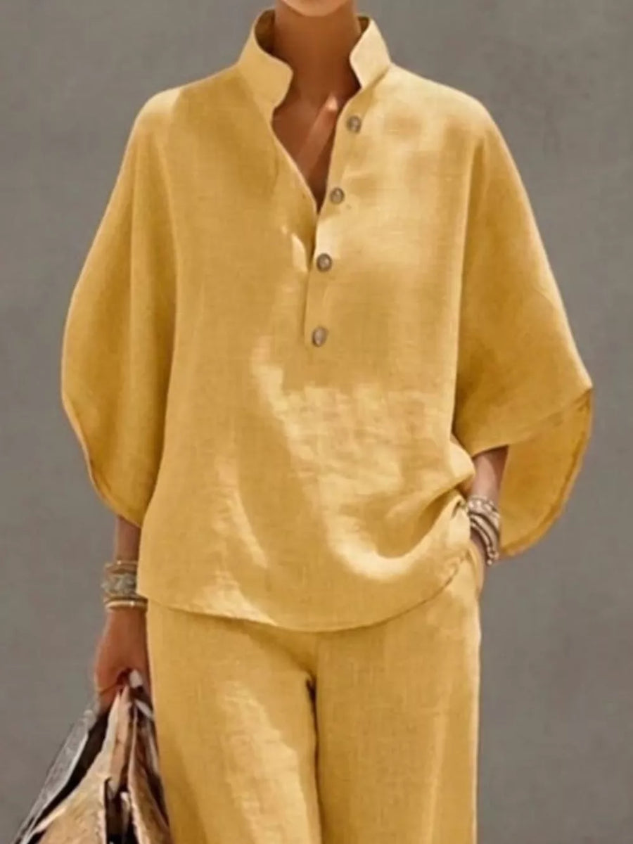 Yellow button-down loungewear set with wide sleeves and a stand collar.