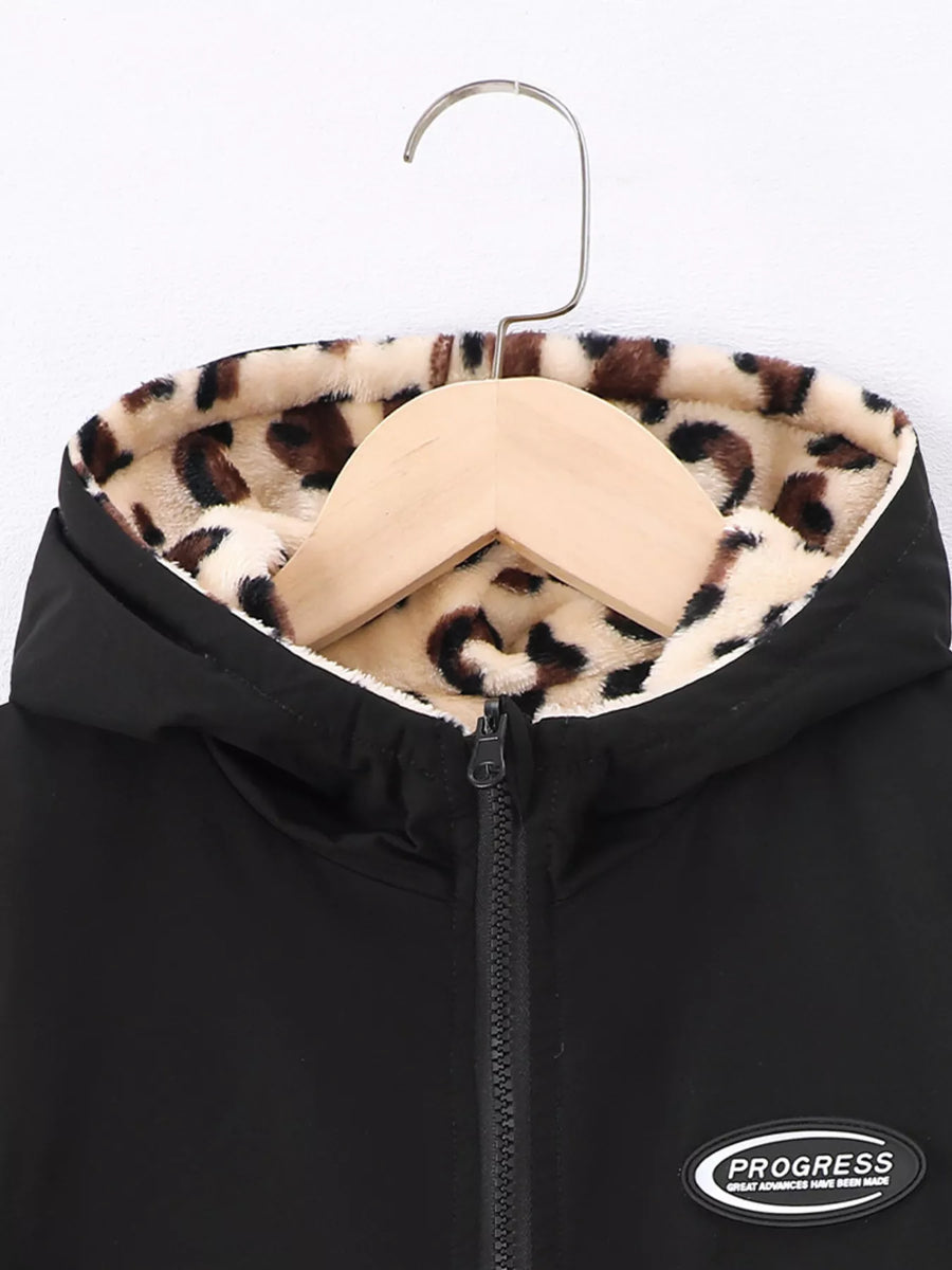 Black hooded jacket with leopard print fuzzy lining and zipper detail.
