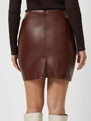 Brown faux leather wrap mini skirt with asymmetrical hem detail.