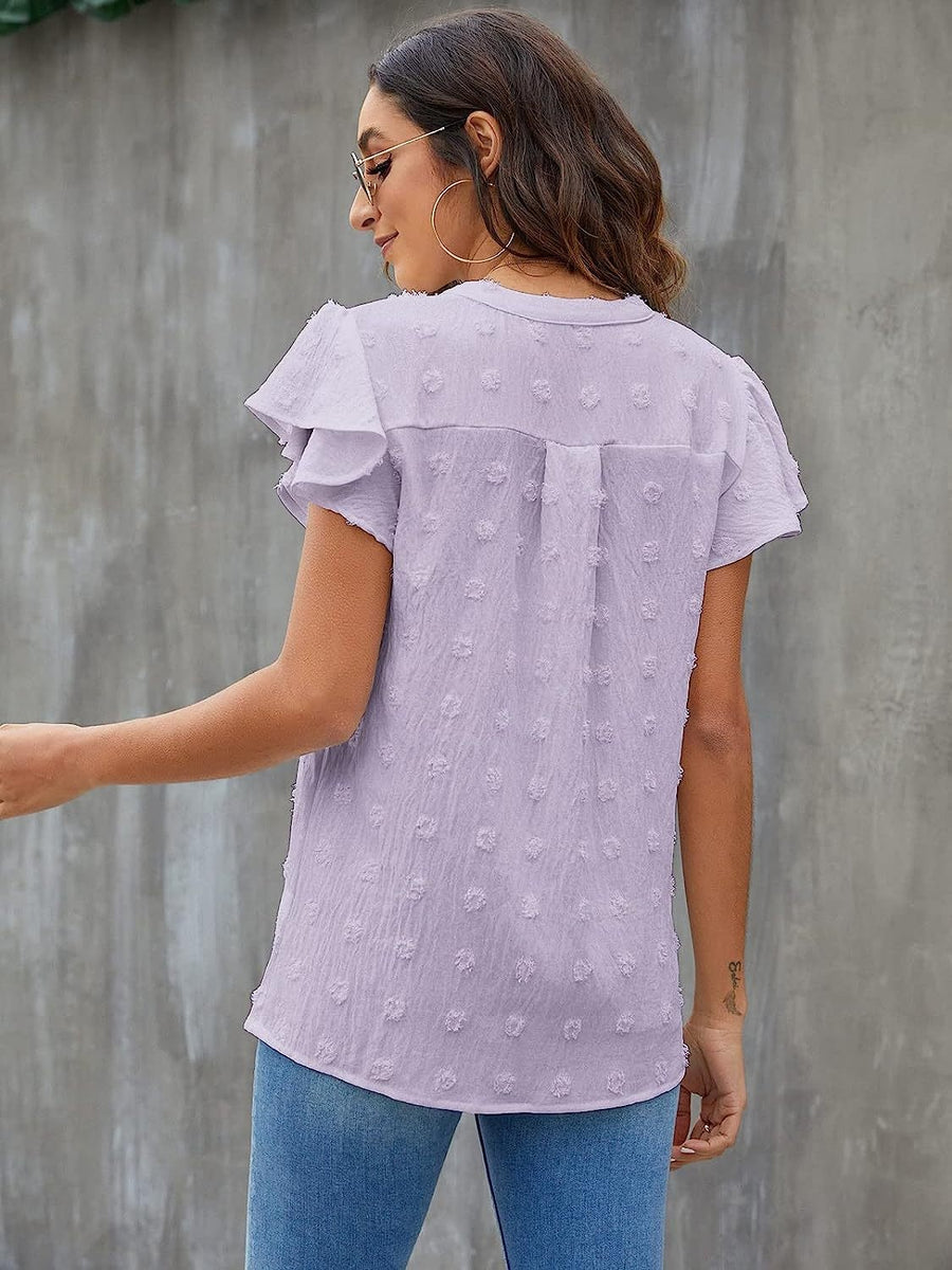 Lavender flutter sleeve Swiss dot blouse with v-neck and ruffled details.