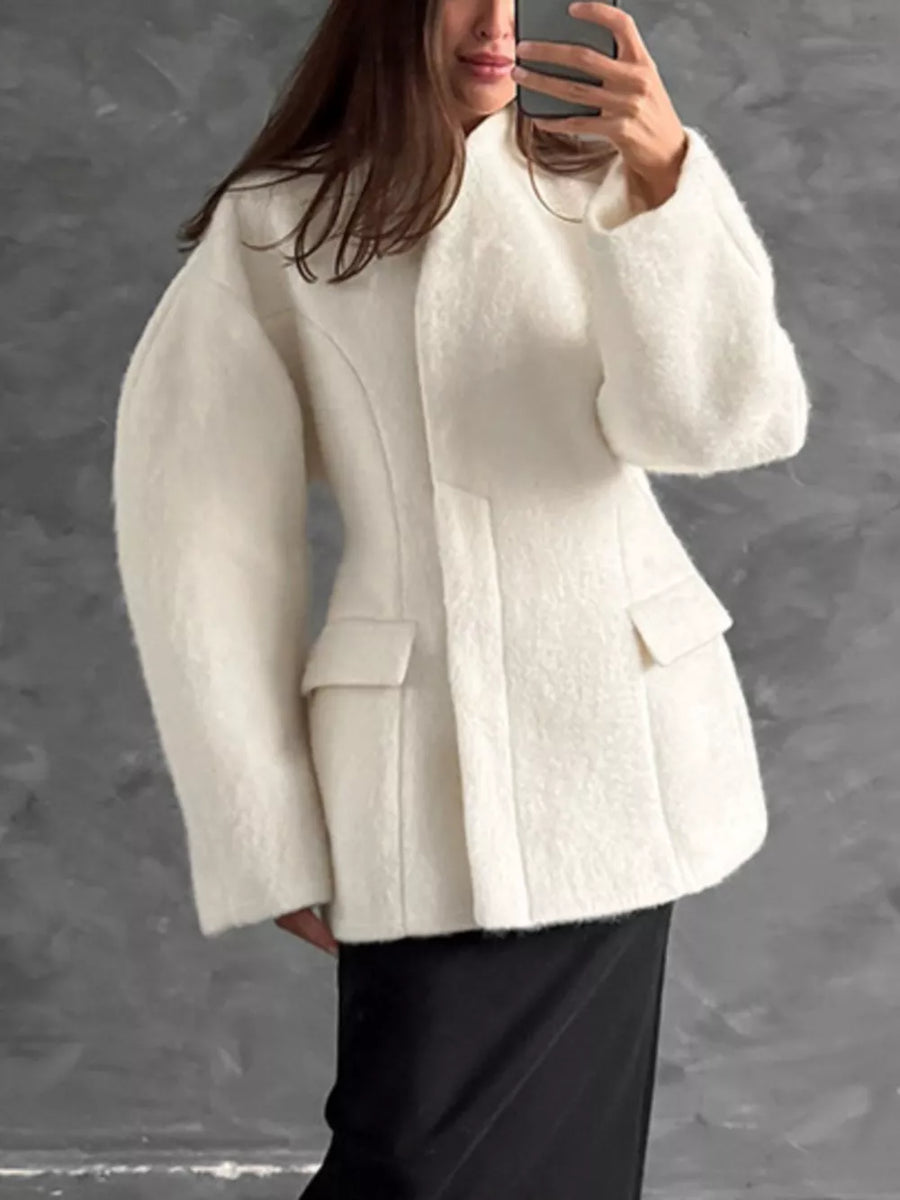 cream coat with seam detail and puff sleeve