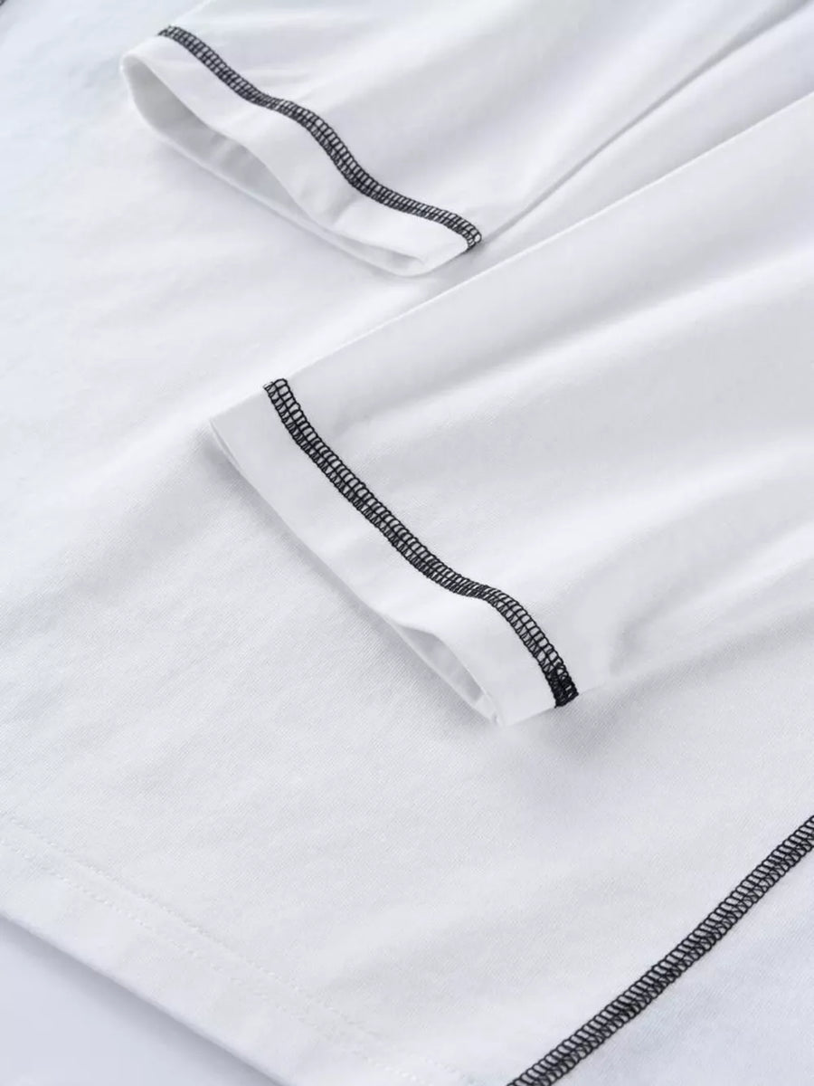 White t-shirt featuring contrast stitching and graphic