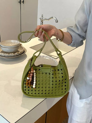 shoulder bag in sage green featuring woven and hobo fit