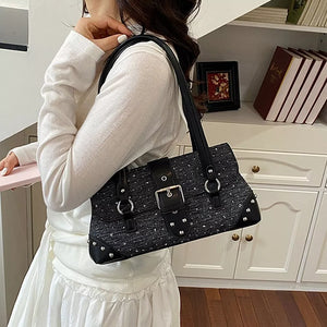 black handbag with medium and flap closure