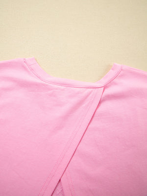 Pink cotton blend oversized tee with a crossover back detail.