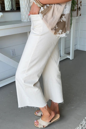 98% cotton, 2% elastane Care instructions: Machine wash cold jeans in cream with loose silhouette