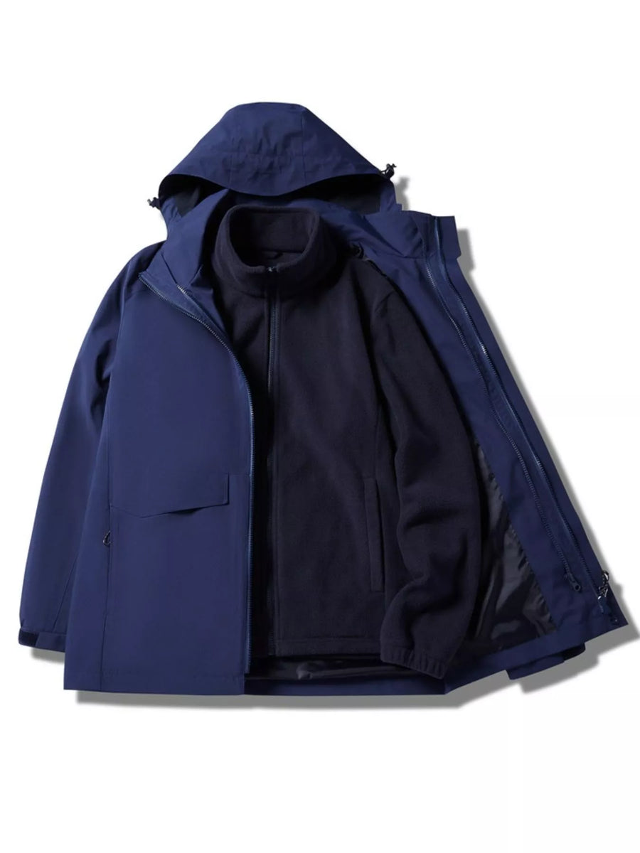 Men's dark blue hooded waterproof jacket with zip-out fleece liner.