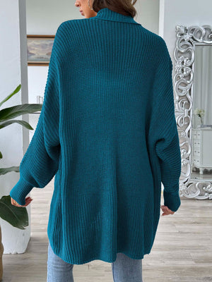 French Blue ribbed knit cardigan with pearl buttons, long sleeves, and a relaxed fit.
