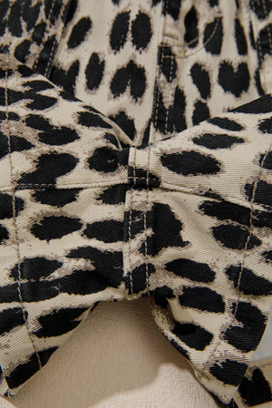 Denim shorts with leopard print and lace-up detail.