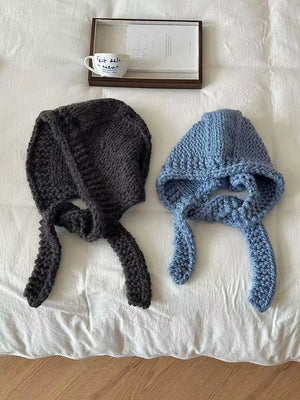 Chunky knit wool earflap beanies in Hemp Gray and Blue with long ties.