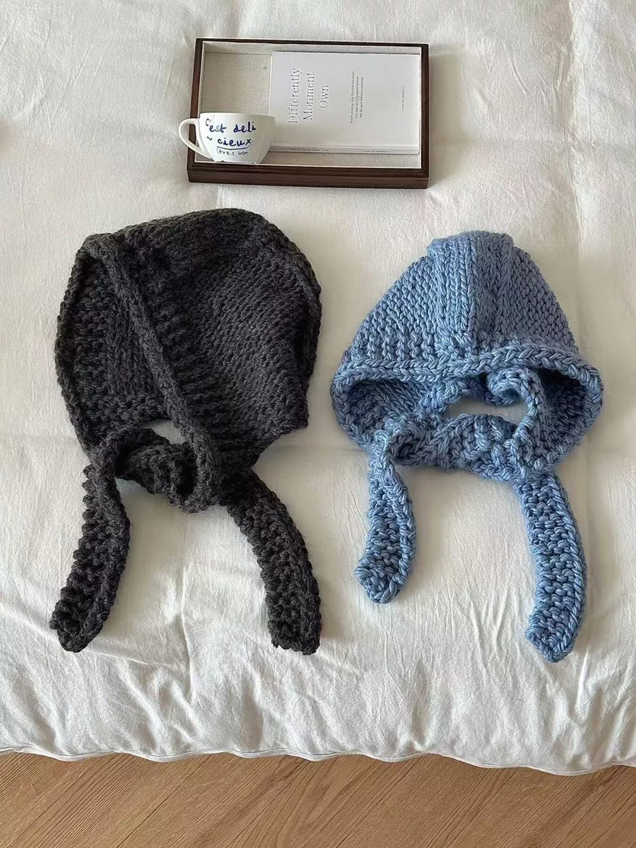Chunky knit wool earflap beanies in Hemp Gray and Blue with long ties.